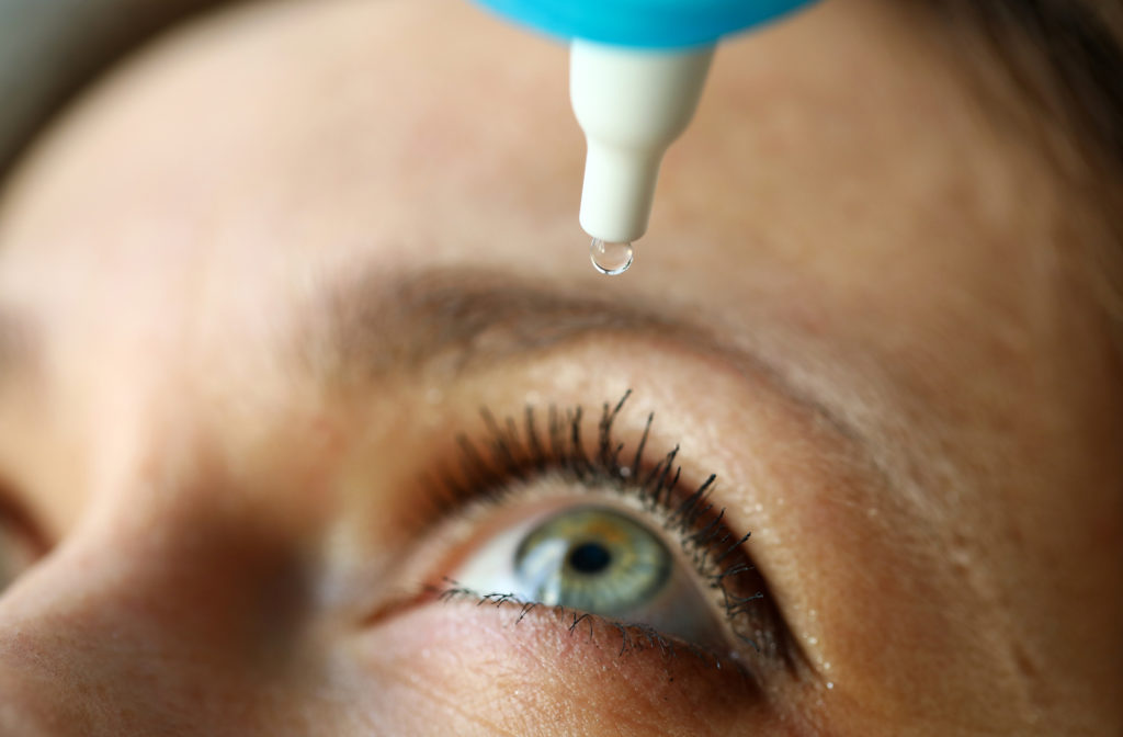 close up of woman inserting eye drops