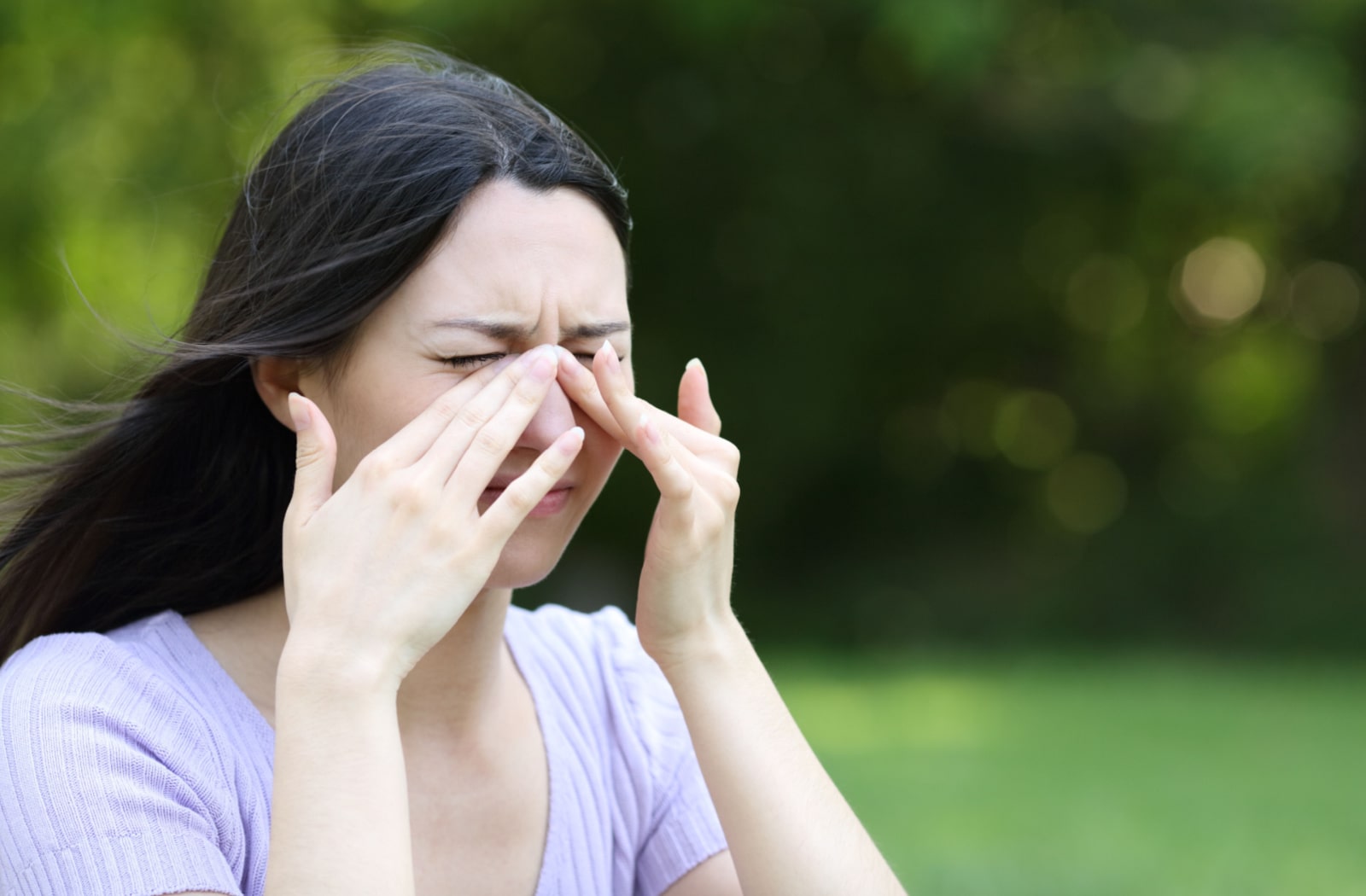 A woman dealing with seasonal allergies. 